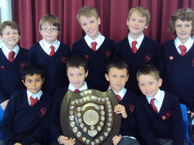 Year 6 Boys' winning team with trophy